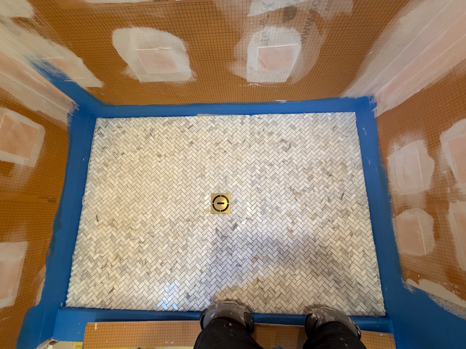 Herringbone floor installation by Tile of America in West Yarmouth MA