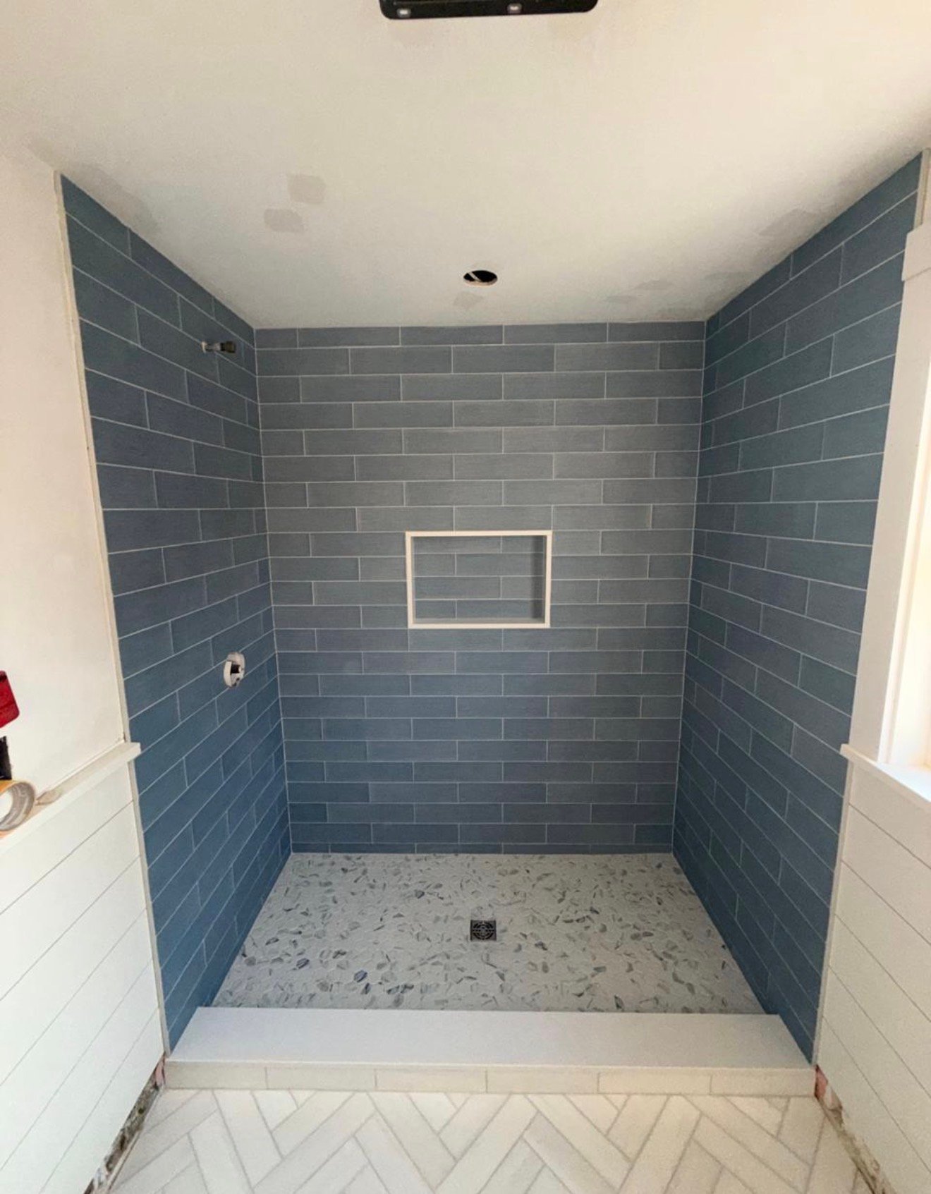 Blue subway tile shower installation by Tile of America in West Yarmouth MA
