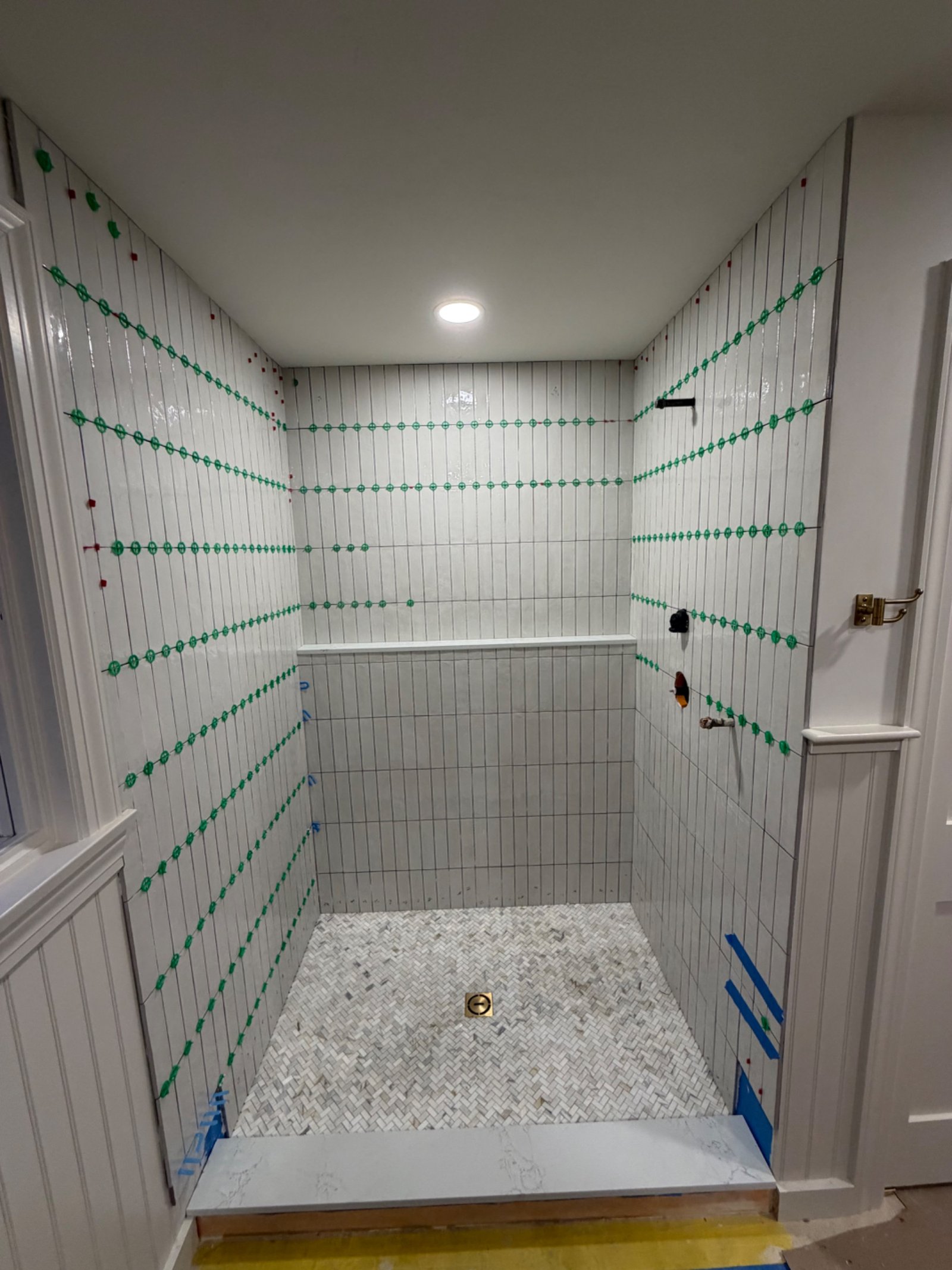 White subway tile shower installation by Tile of America in West Yarmouth MA